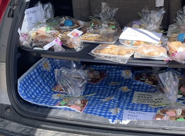 Photo of open car trunk with Easter baking.