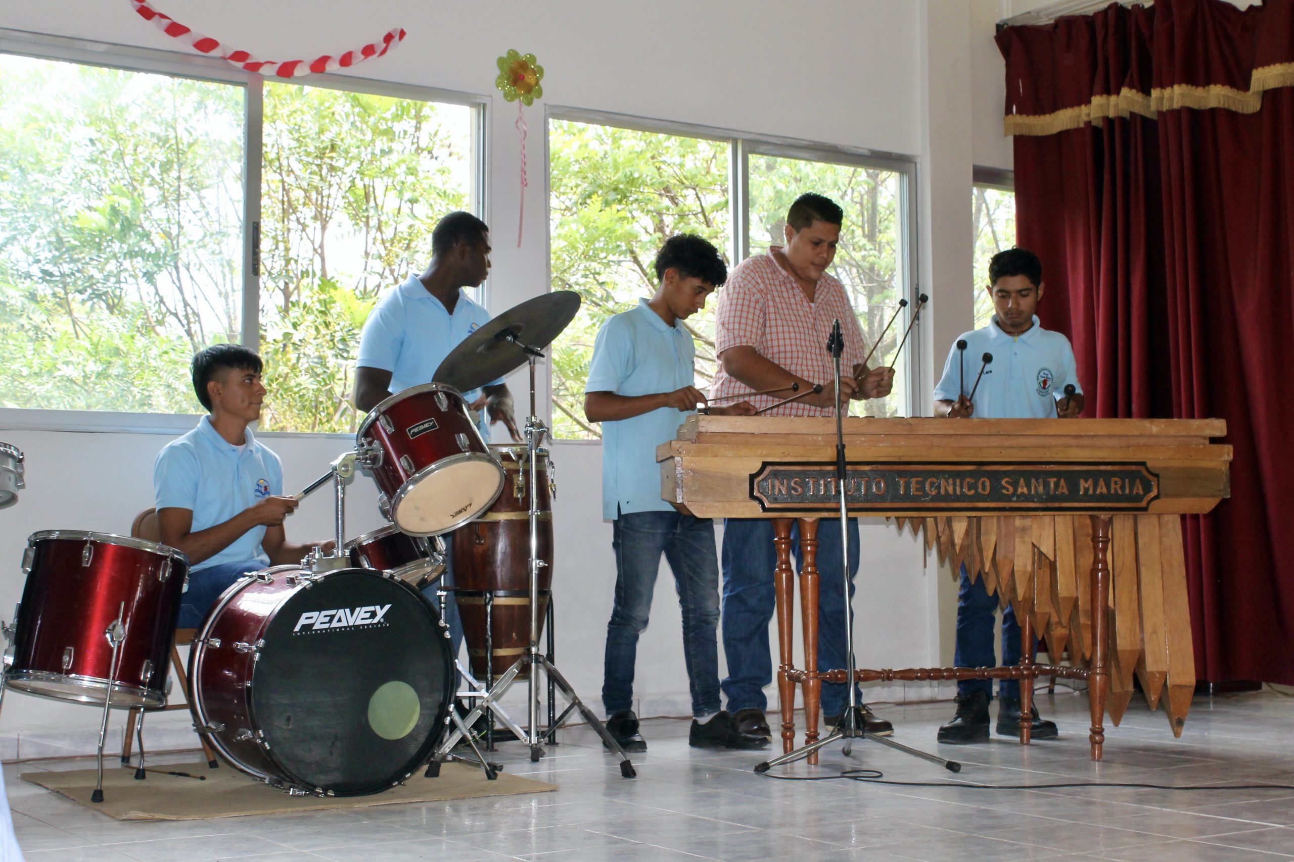 Photo of students and teacher playing music at Technical Institute